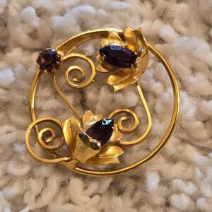 Vintage Gold Tone Floral Circle Brooch Featuring 3 purple rhinestones